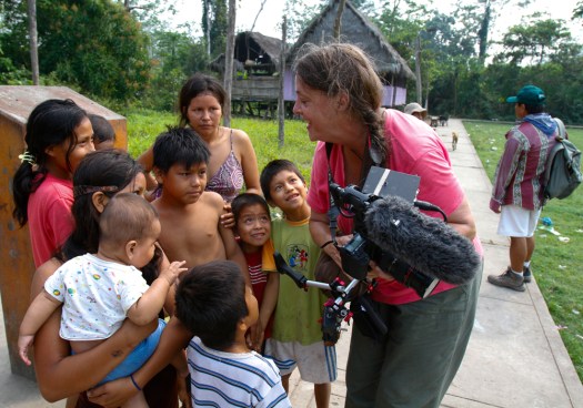 Gail showing video to children of remote Amazon village, Peru