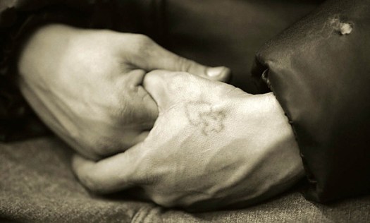 Hands of man in homeless shelter, New York City